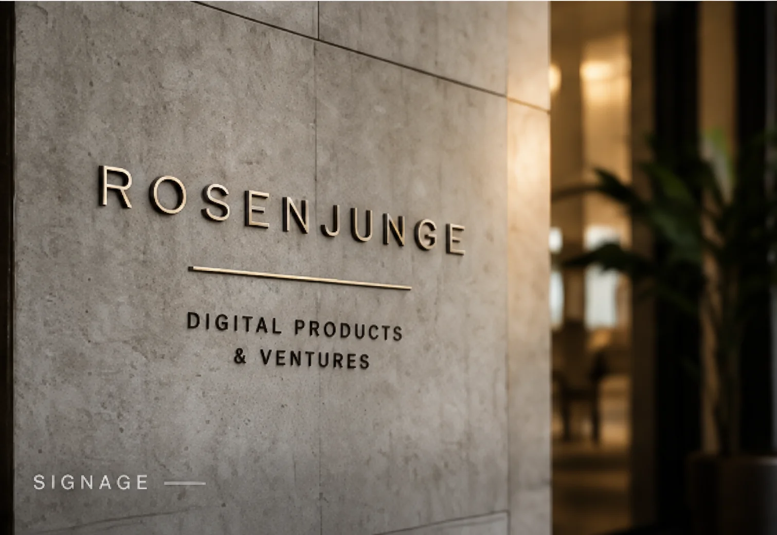 Rosenjunge-Beschriftung auf einer Steinwand mit dem Untertitel Digital Products & Ventures